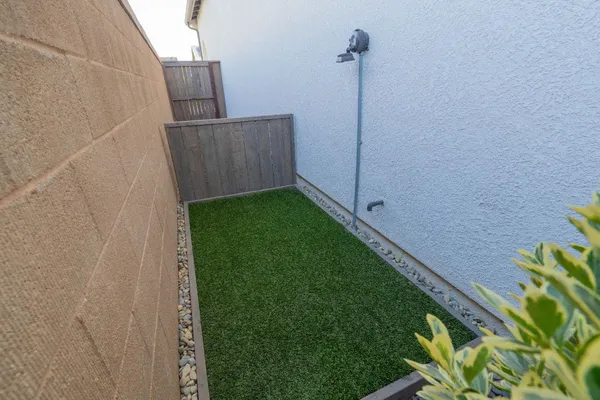 a outdoor dining space with furniture and a potted plant