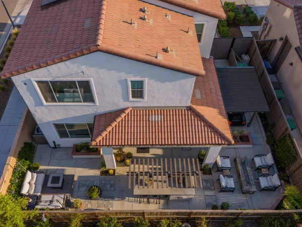 an aerial view of residential houses with outdoor space