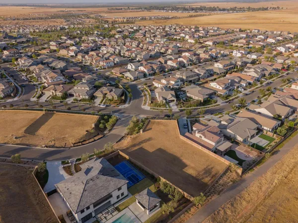 an aerial view of a house with a ocean view