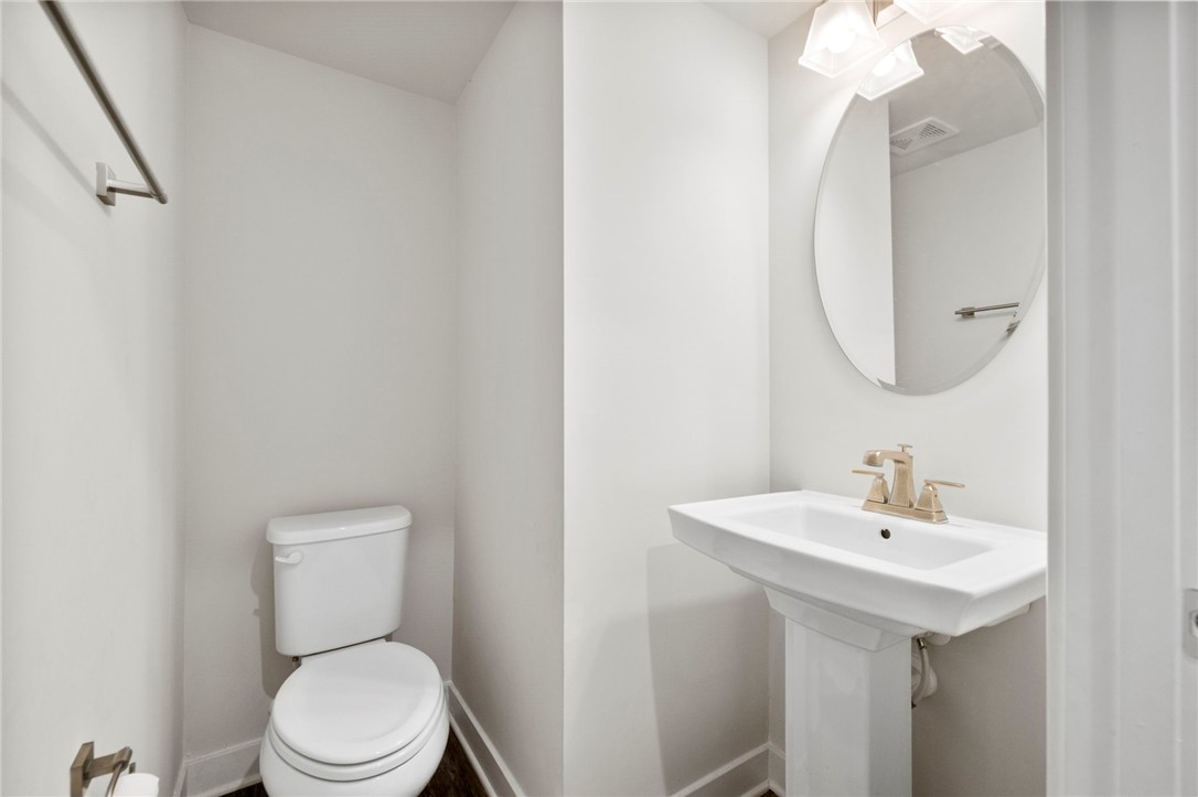 506 Roan Creek Trail Anderson, SC 29621 - Photo 10 of 33 This clean and inviting powder room offers a sleek pedestal sink and contemporary fixtures.