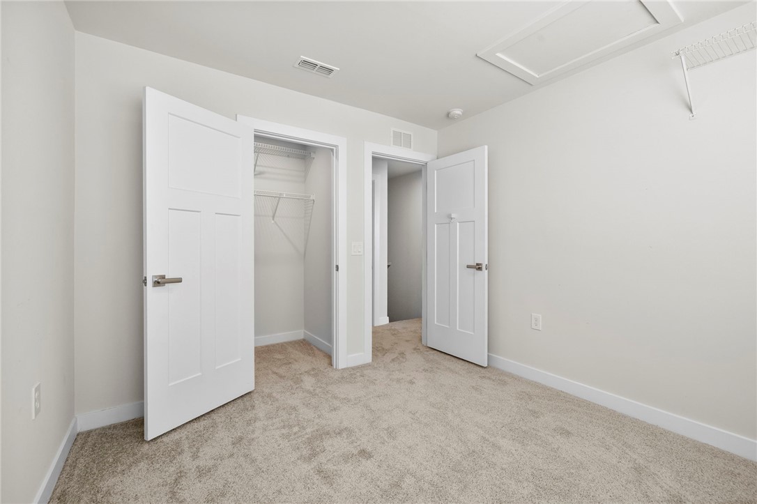506 Roan Creek Trail Anderson, SC 29621 - Photo 23 of 33 This spacious room features a comfortable carpeted floor and ample storage options.