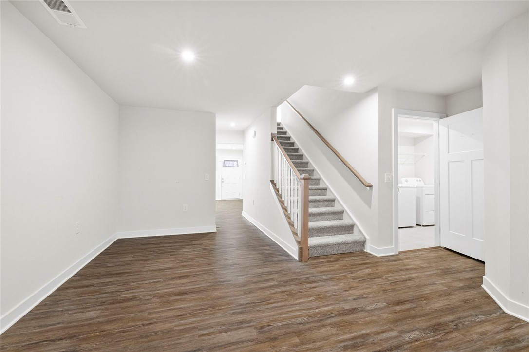 506 Roan Creek Trail Anderson, SC 29621 - Photo 6 of 33 This versatile space features a convenient laundry area and a well-crafted staircase.