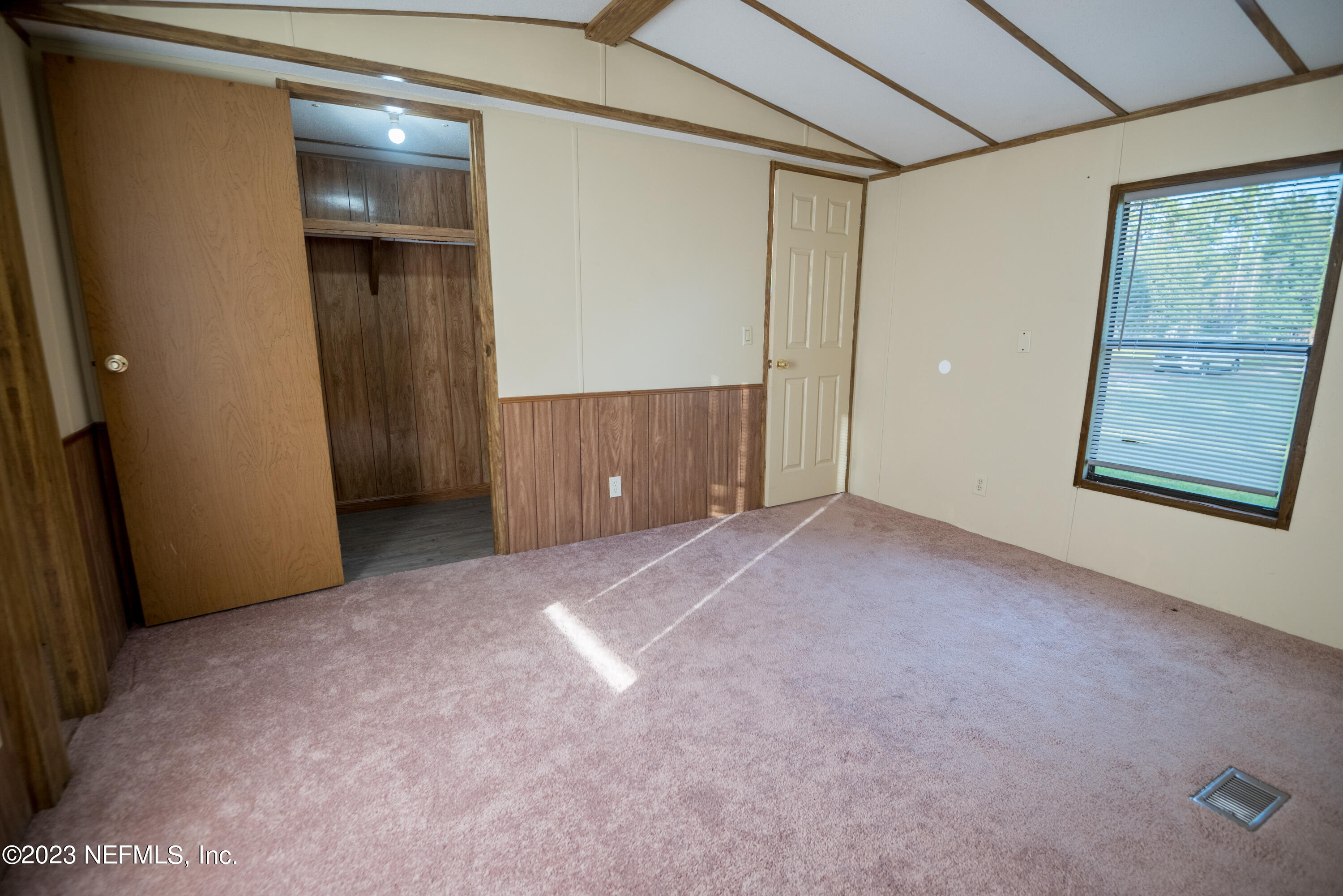 7230 Oakhill Road Keystone Heights, FL 32656 - Photo 17 of 38 an empty room with windows and closet