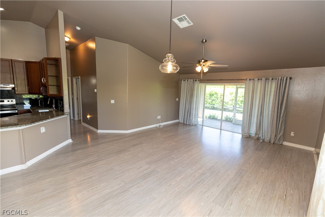 7500 Cameron Circle Fort Myers, FL 33912 - Photo 11 of 21 an empty room with wooden floor and windows