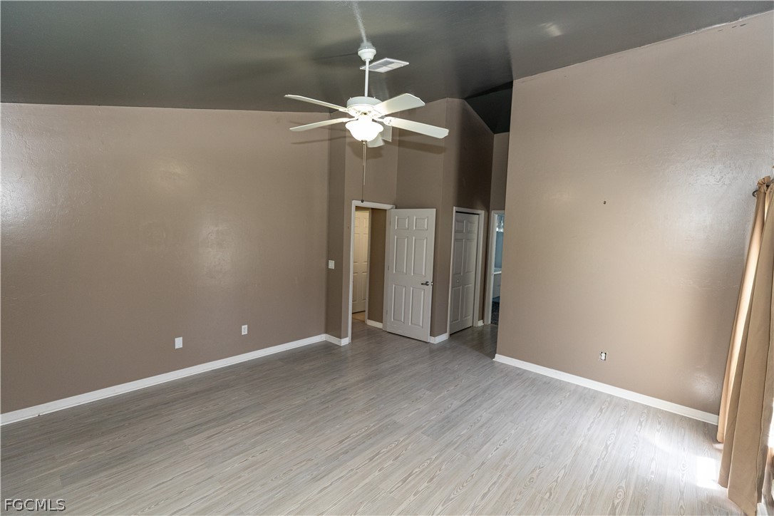 7500 Cameron Circle Fort Myers, FL 33912 - Photo 12 of 21 a view of a chandelier with wooden floor