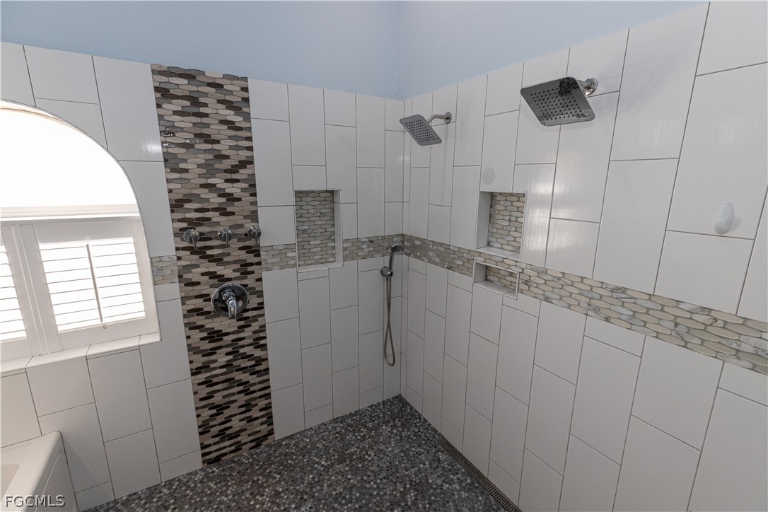 7500 Cameron Circle Fort Myers, FL 33912 - Photo 15 of 21 a bathroom with a shower and a sink