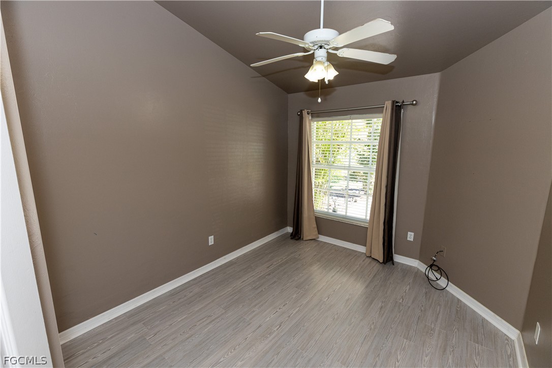 7500 Cameron Circle Fort Myers, FL 33912 - Photo 18 of 21 wooden floor in an empty room with a window