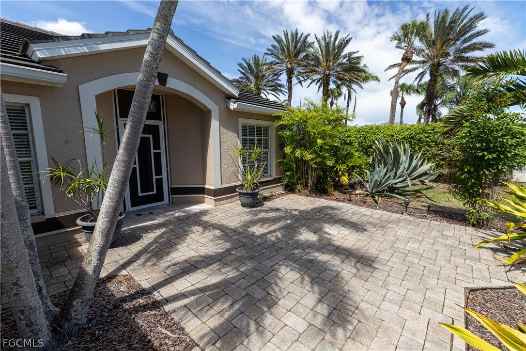 7500 Cameron Circle Fort Myers, FL 33912 - Photo 2 of 21 a view of a house with a yard