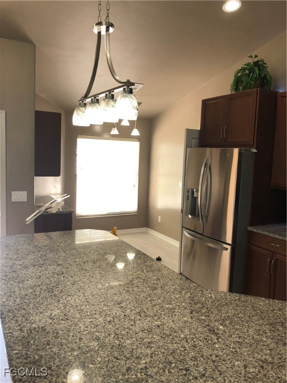 7500 Cameron Circle Fort Myers, FL 33912 - Photo 3 of 12 a kitchen with a refrigerator a stove and a microwave