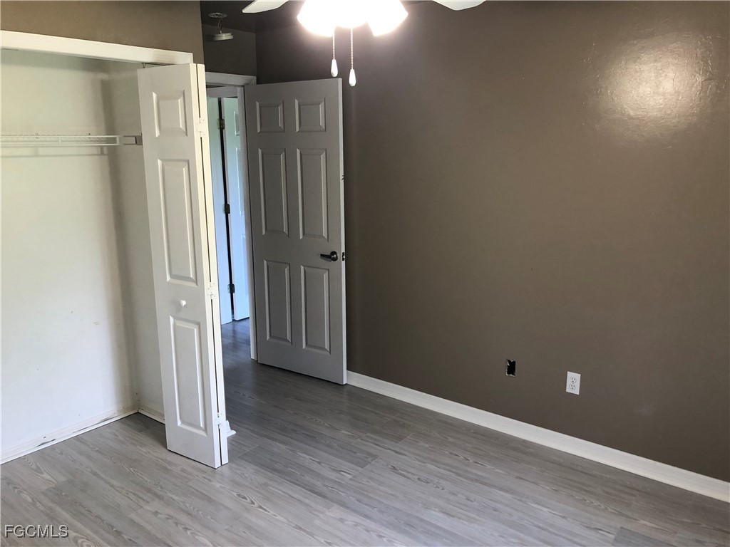 7500 Cameron Circle Fort Myers, FL 33912 - Photo 9 of 12 a view of empty room with wooden floor
