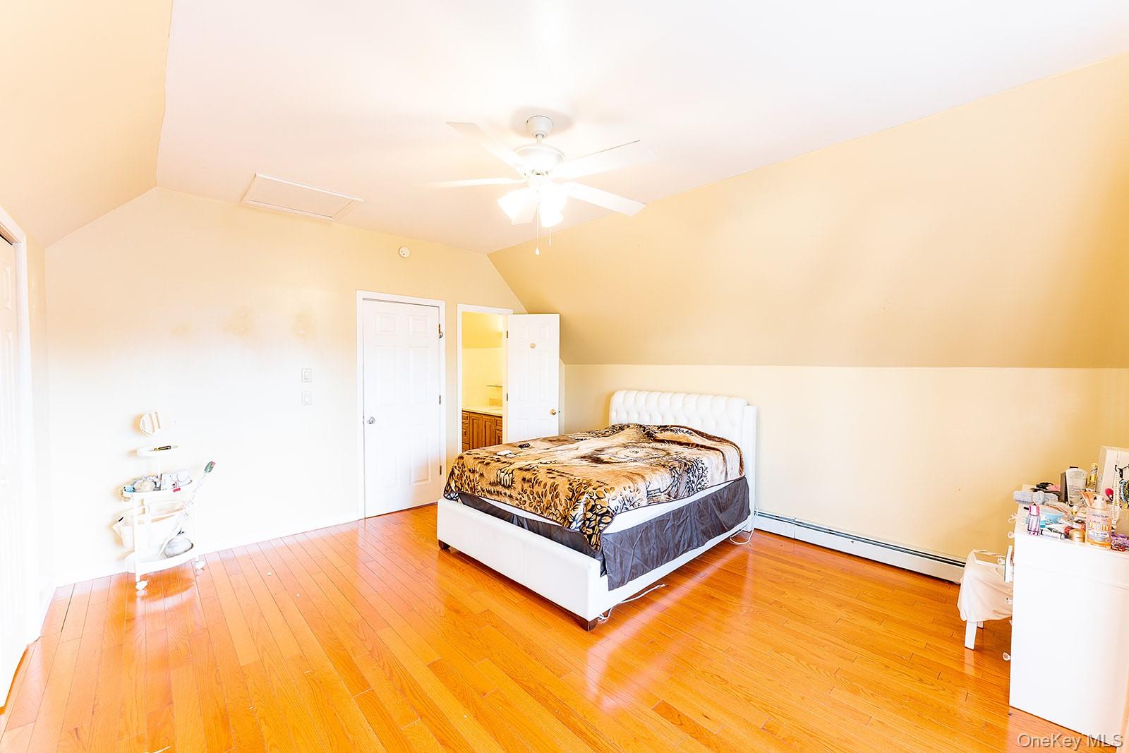 612 Ringgold Street Peekskill, NY 10566 - Photo 17 of 23 a living room with a bed and a potted plant