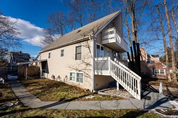 a view of a house with wooden stairs