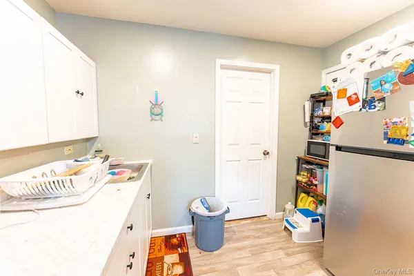 a bedroom with a bed and a white cabinets