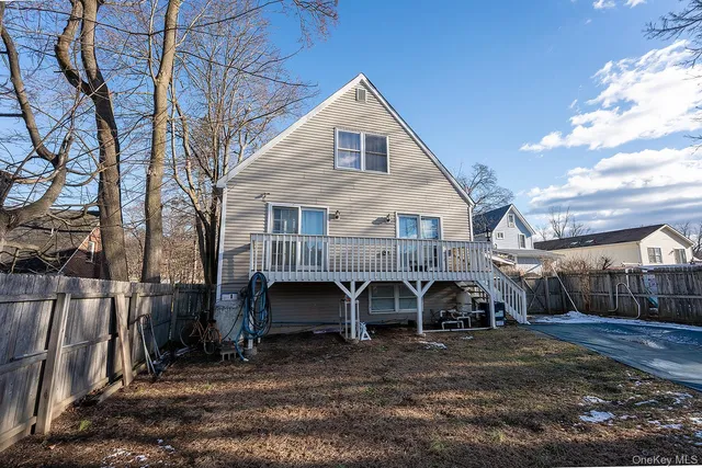 a view of a small house with roof deck