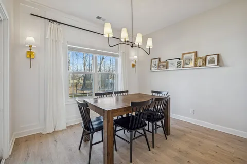 a living room with furniture fireplace and flat screen tv