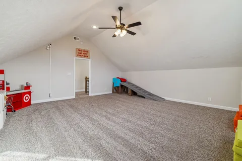 a room with a table and a fireplace