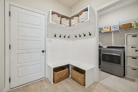 a view of a patio with a table and chairs