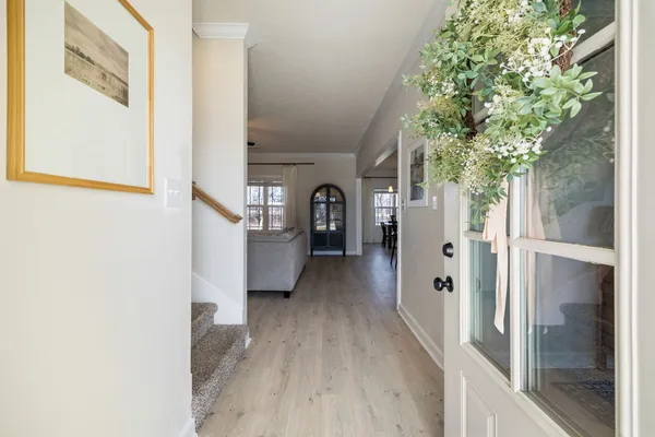 a kitchen with granite countertop a sink a counter space appliances and cabinets