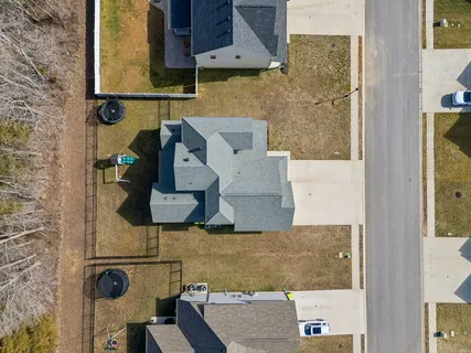 a view of swimming pool with outdoor seating and plants