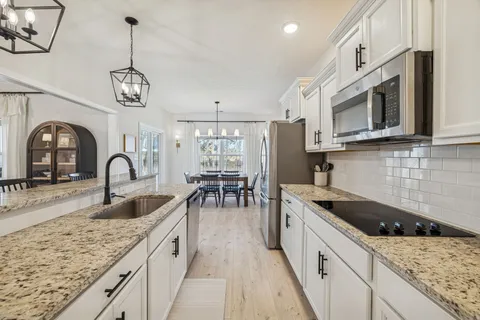 a view of living room with granite countertop furniture and fireplace