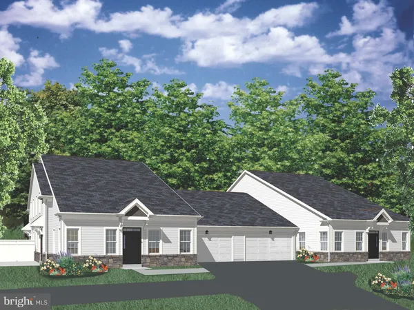 a view of house with a big yard