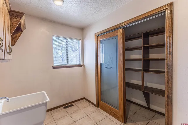 a utility room with cabinets dryer and washer