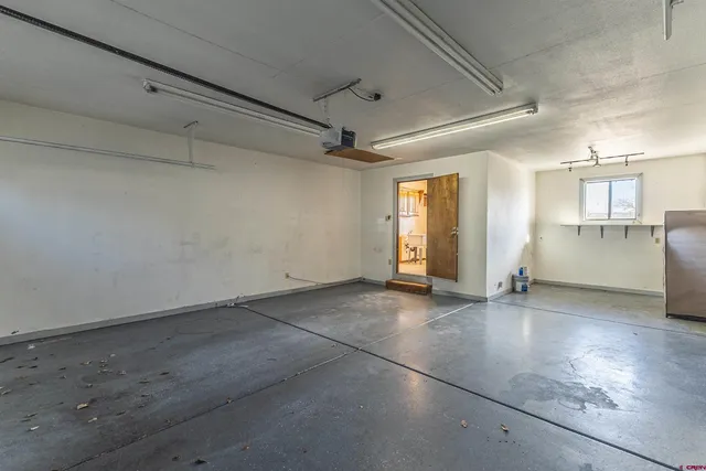 wooden floor in an empty room with a fireplace