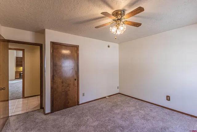 a view of a bathroom from a hallway