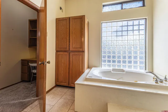 a bathroom with a shower and a mirror