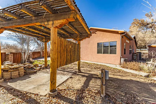 a view of house with backyard