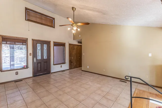 a kitchen with stainless steel appliances granite countertop a sink and a stove