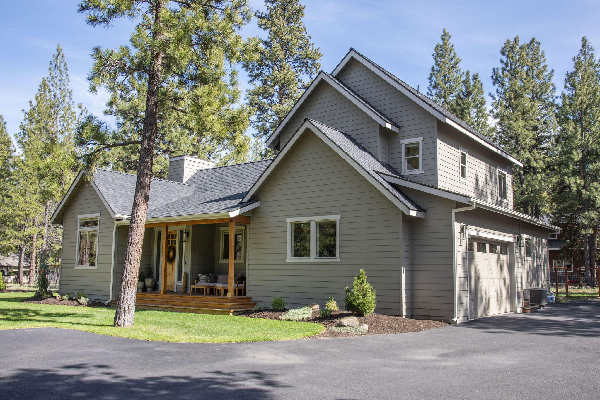 69270 Lariat Sisters, OR 97759 - Photo 1 of 47 Angled home and side garage view