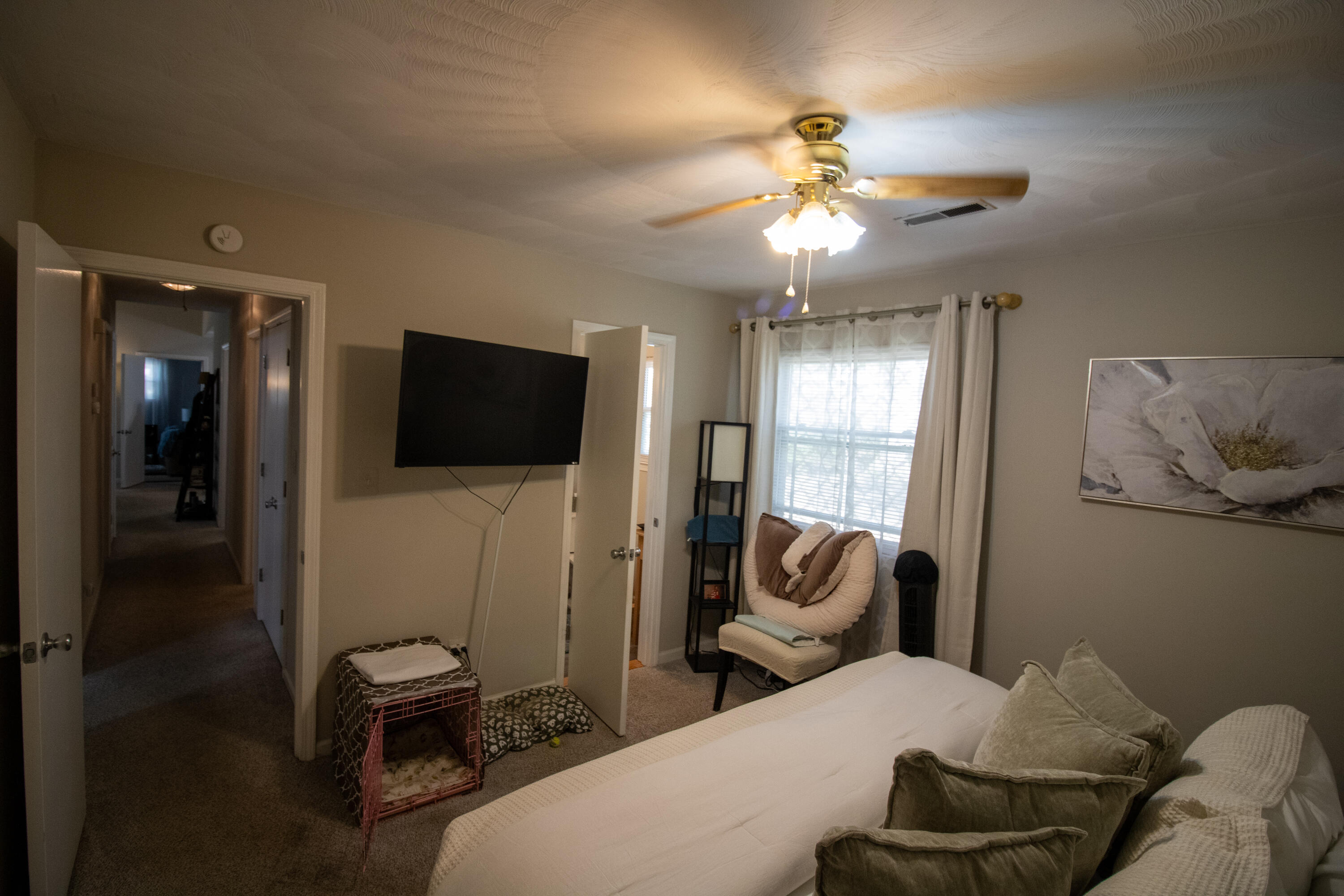 1858 Kiska Road Salem, VA 24153 - Photo 14 of 21 a bedroom with a bed and a chandelier