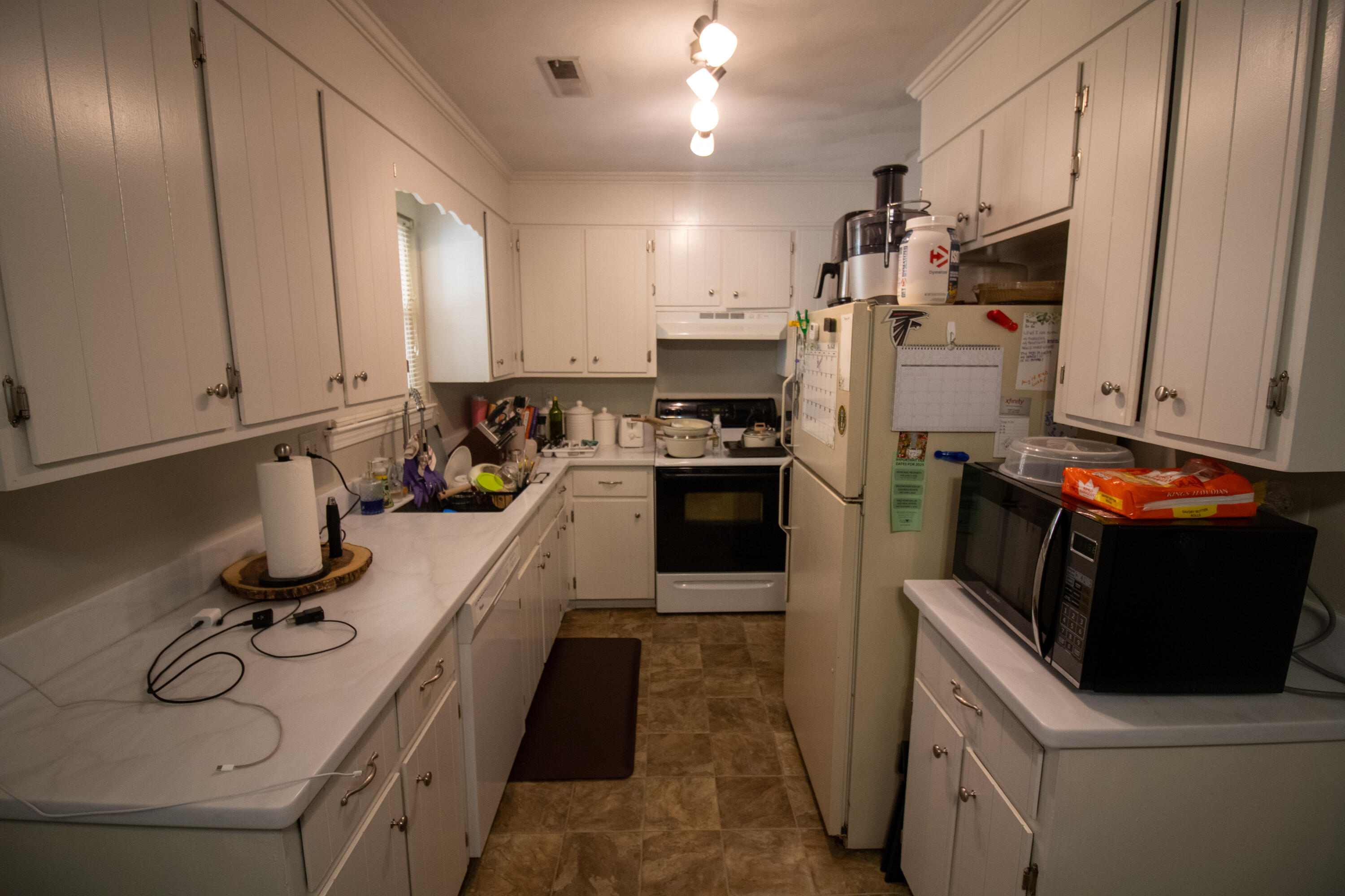 1858 Kiska Road Salem, VA 24153 - Photo 2 of 21 a kitchen with kitchen island granite countertop a sink appliances and cabinets