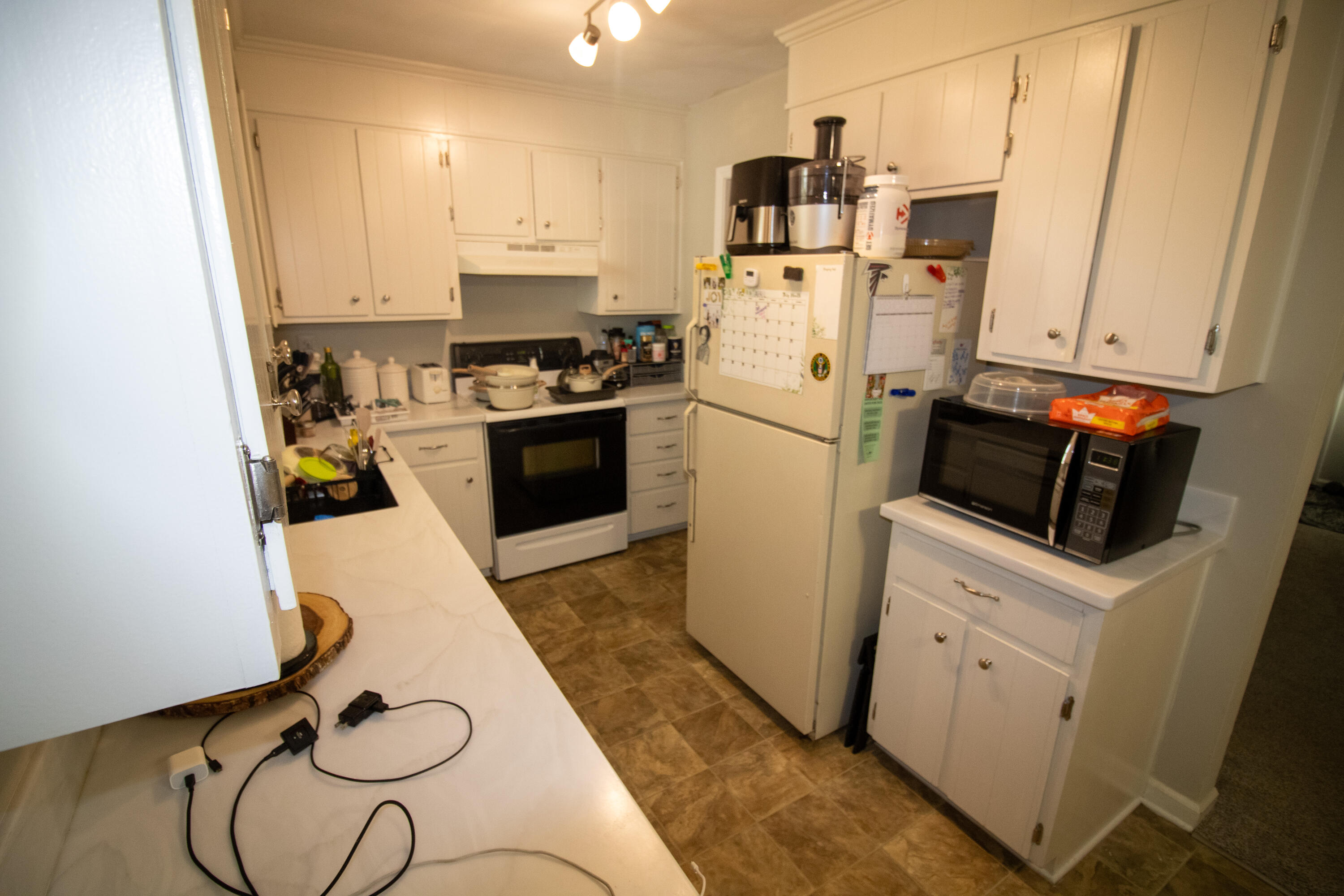 1858 Kiska Road Salem, VA 24153 - Photo 3 of 21 a kitchen with sink a refrigerator and cabinets