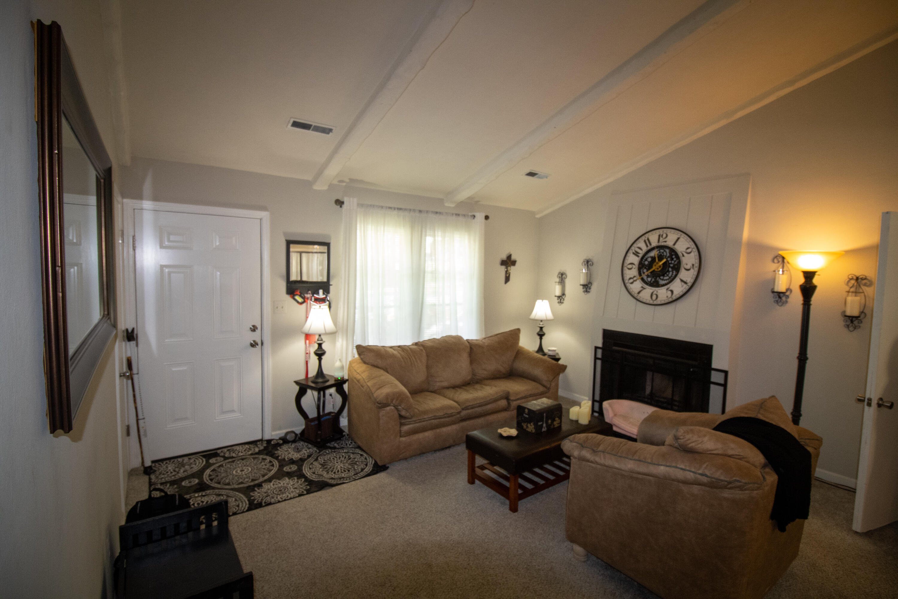 1858 Kiska Road Salem, VA 24153 - Photo 7 of 21 a living room with furniture a fireplace and a flat screen tv