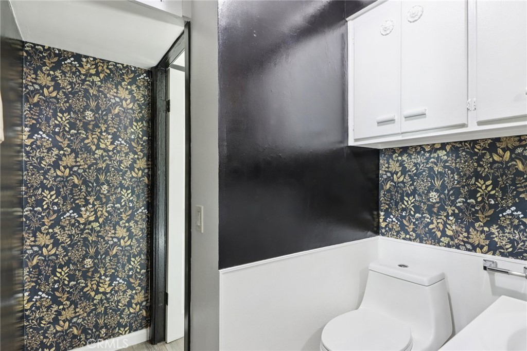 532 Sunset Lane Crestline, CA 92325 - Photo 16 of 41 a white toilet sitting next to a shower curtain