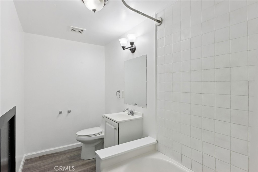 532 Sunset Lane Crestline, CA 92325 - Photo 21 of 41 a white toilet sitting next to a bathroom sink