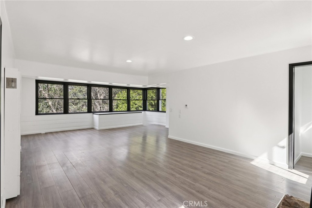 532 Sunset Lane Crestline, CA 92325 - Photo 37 of 41 wooden floor in an empty room with a window