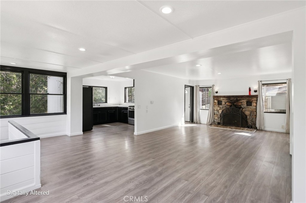 532 Sunset Lane Crestline, CA 92325 - Photo 38 of 41 a view of empty room with wooden floor and fireplace