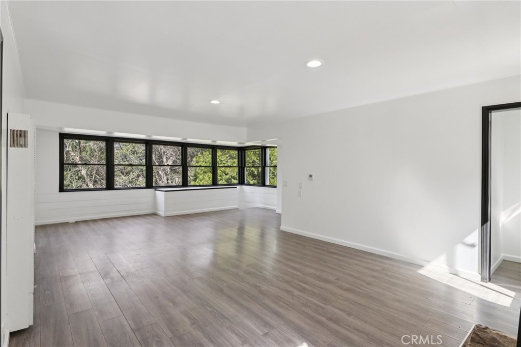 532 Sunset Lane Crestline, CA 92325 - Photo 10 of 41 wooden floor in an empty room with a window