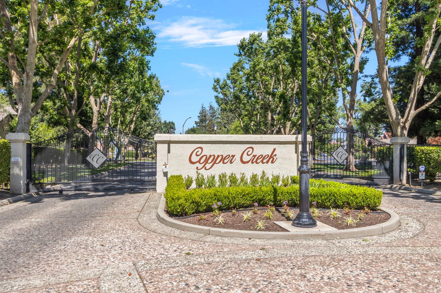 1013 Copper Lake Court Modesto, CA 95355 - Photo 49 of 66 a sign on the side of the road