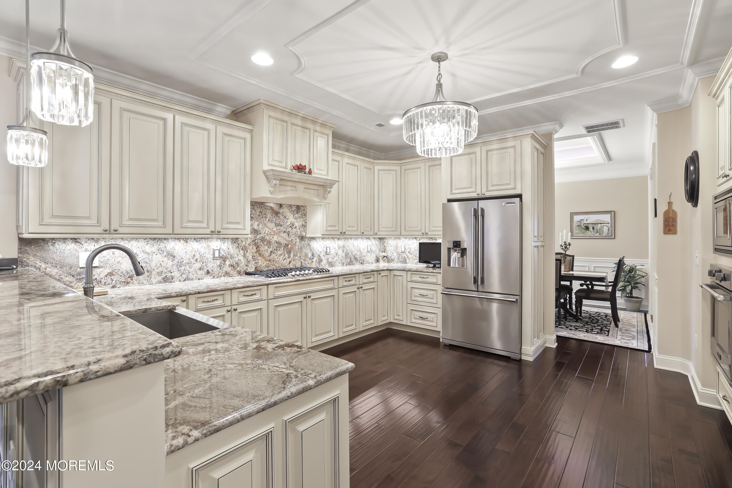 3 Garden Path Barnegat, NJ 08005 - Photo 13 of 59 a kitchen with stainless steel appliances granite countertop a refrigerator a sink dishwasher a stove and white cabinets with wooden floor