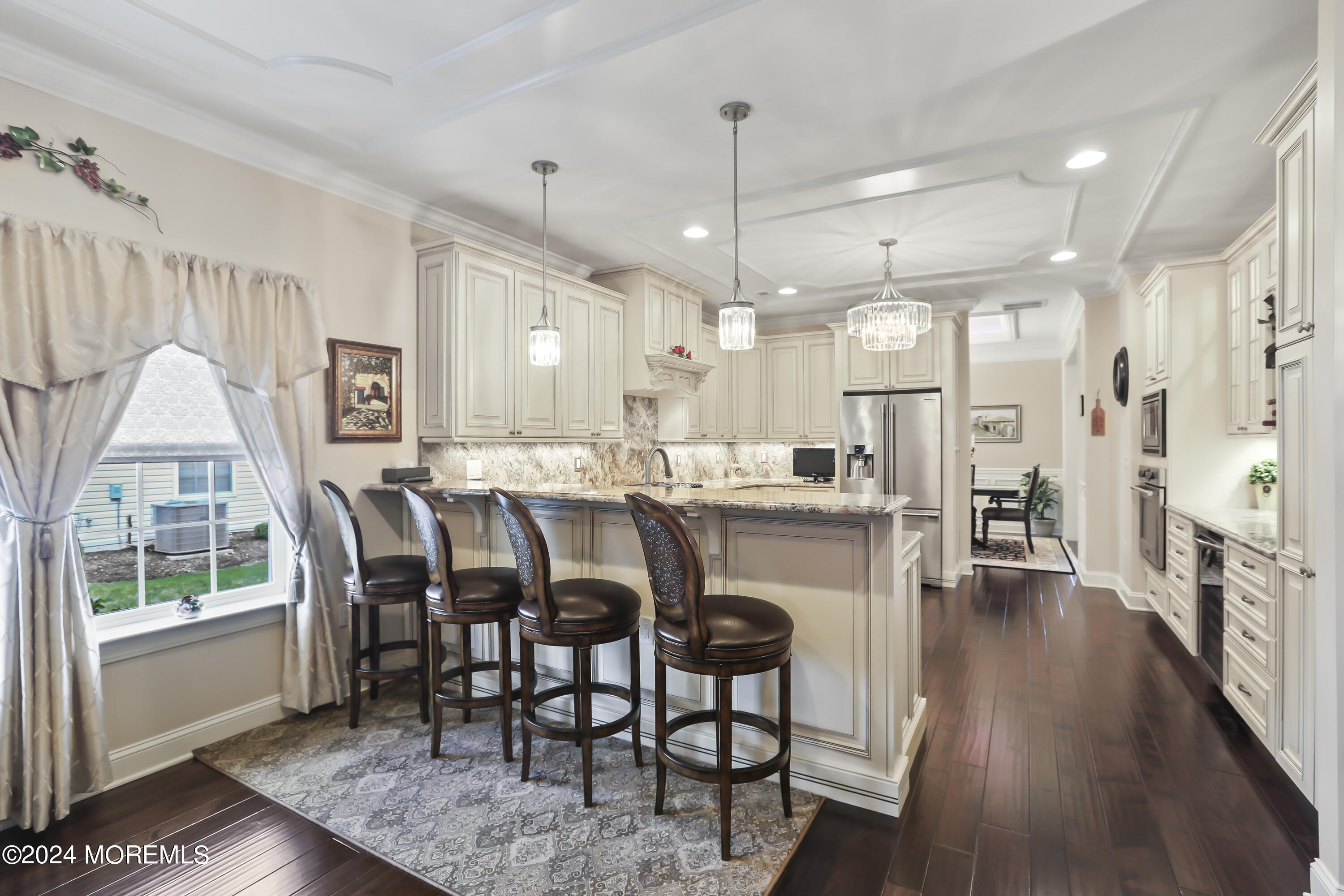3 Garden Path Barnegat, NJ 08005 - Photo 17 of 59 a dining room with stainless steel appliances granite countertop furniture wooden floor and a chandelier