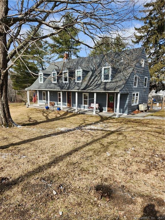 21 Anderson Rd Extension Morris, CT 06763 - Photo 1 of 1 a front view of a building with a yard