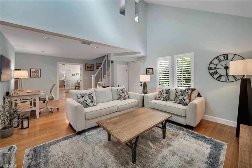 1269 Solana Road, Unit E3 Naples, FL 34103 - Photo 3 of 23 a living room with furniture a rug and a window