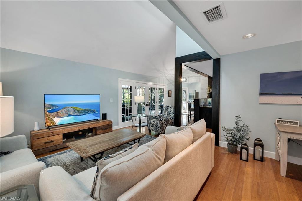 1269 Solana Road, Unit E3 Naples, FL 34103 - Photo 4 of 23 a living room with furniture and a flat screen tv