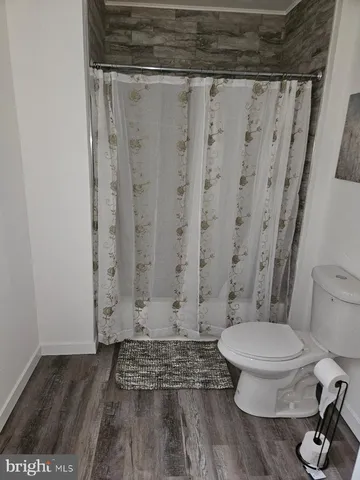 a bedroom with a bed and a rug