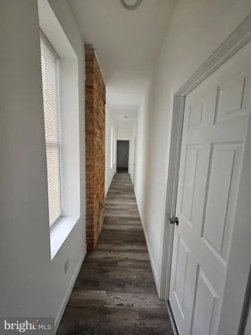 a kitchen with granite countertop a stove and a sink