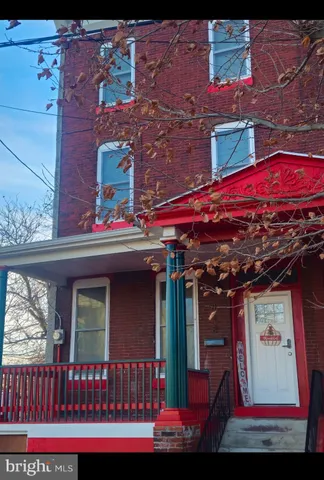 a living room with a couch and a rug